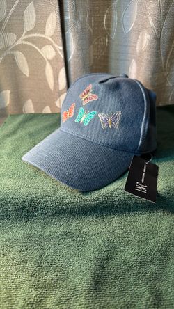 I.N.C. International Concepts, a brand exclusive to Macy's.Product DetailsThe cap features four multi-colored butterflies embroidered on a light-wash
