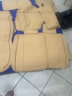 Beige leather car seat covers in good condition