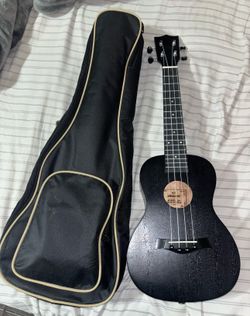 Like New Ukulele Bundle - Bag, Tuner, Strap