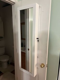 Jewelry cabinet with mirror