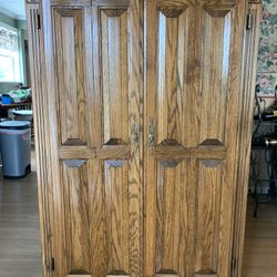 Solid oak computer desk/cabinet 57 3/4” W 38” D 21” 