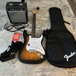 Fender Stratocaster with Amp, strap, tuner, guitar case, pick, cord for amp and 3 month free online lessons