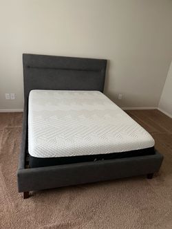 Queen Bed for Sale Queen-size bed with a fabric upholstered frame. Color: dark gray/blue. Clean and in good condition.