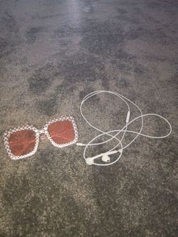 Pink sun glasses, headphones