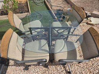 5-Piece Glass Top Dining Set with Rolling Chairs "with delivery"