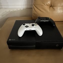 Xbox One + 2 Controllers + 8 Games. $200