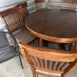 Table top 54”around H36” Very good condition wood table with 7 matching chairs