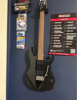 Black guitar and speaker