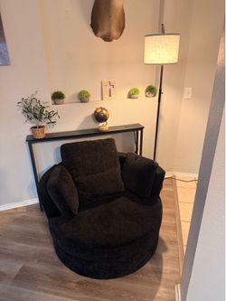 Swivel couch with lamp and table