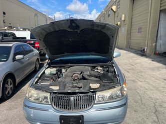 Light blue Lincoln town car executive