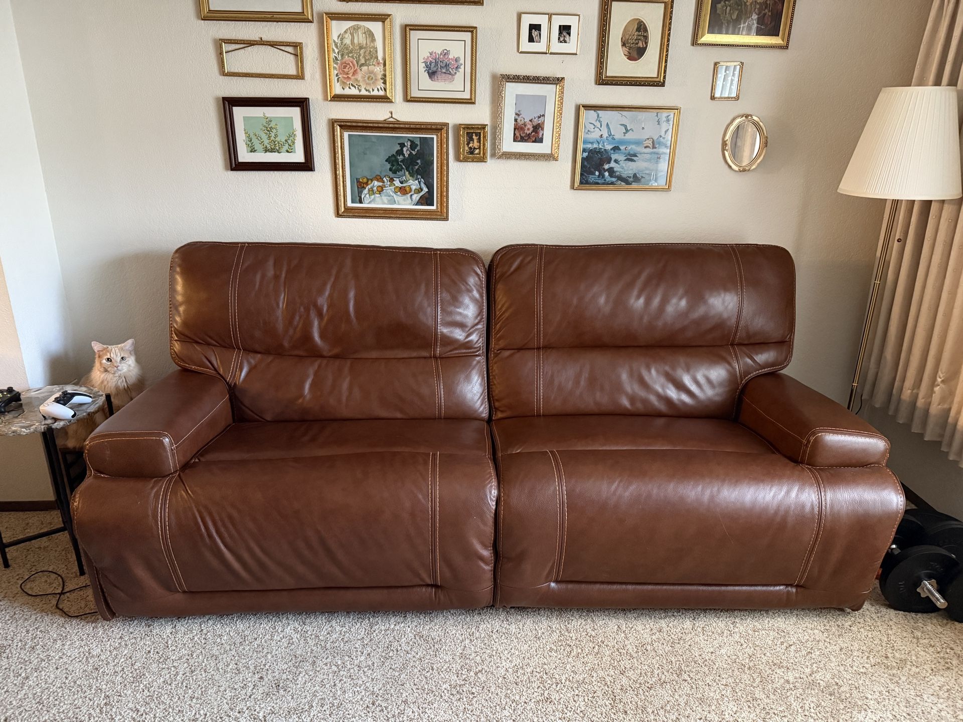 Two Real Leather Reclining Couches With Cup Holder And Charging Ports