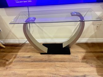 Two glass coffee tables. One tall and one low. Excellent condition.
