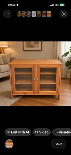 Newer IKEA Leksvik TV cabinet is crafted from solid pine and two glass doors.