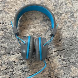 blue and grey J lab headphones with mic