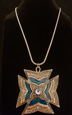 $10. Beautiful bold silver tone necklace with green enamel and baby blue rhinestones. Necklace is 20 in. Pendant is 3 in by 3 in. Marked Roman, Inc.