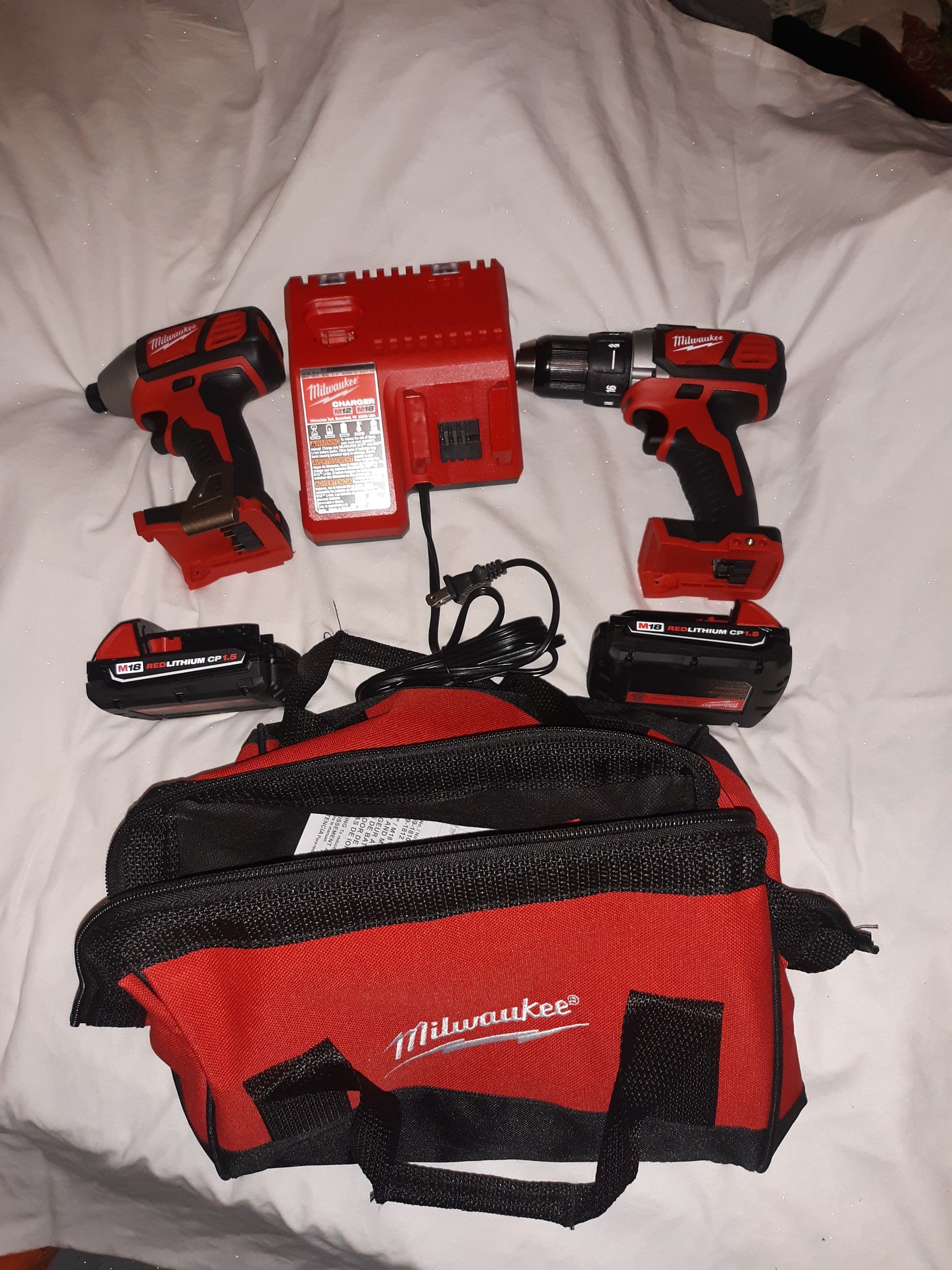 Milwaukee impact drill hammer drill and charger brand new