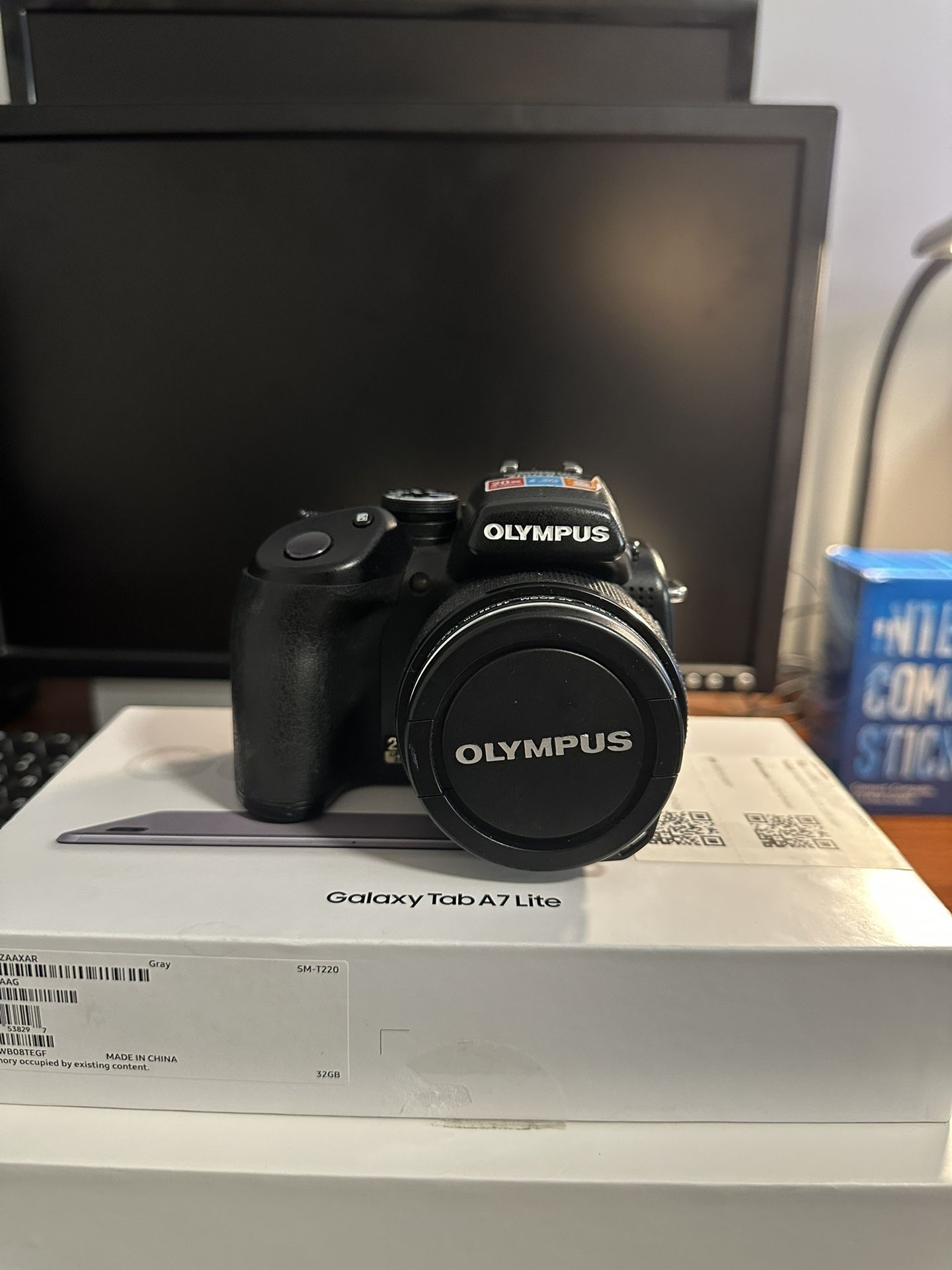 * Olympus SP-57OUZ 10MP digital Camera with 20x Optical dual image stabilized Zoom 
