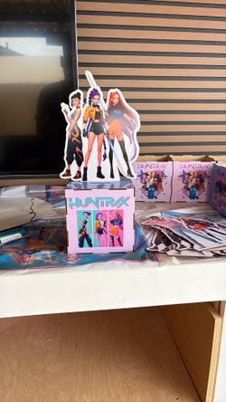 Huntrix table displays pig bags