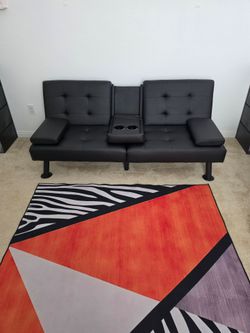 Sofa Couch Black like new turn intr o bed need it gone asap first come get it Rug included