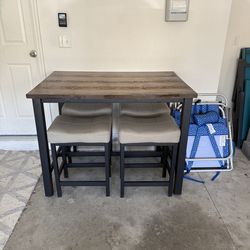 Bar height table and 4 stools