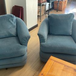 Two Blue Swivel Barrel Chairs 