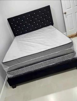 Queen size bed with upholstered headboard