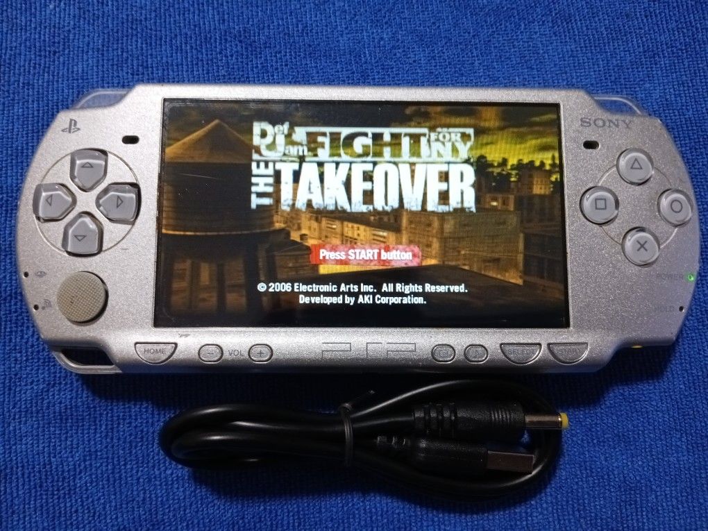 PSP Sliver With Charger And Games Inside