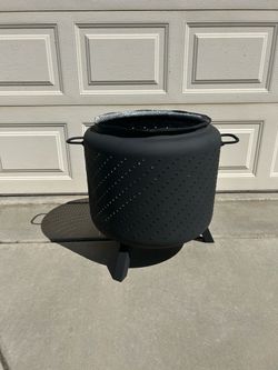 Fire Pit made from washing machine tub with legs and handles painted with high temp BBQ Paint