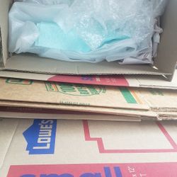 Bundle Of Moving Boxes With Packing Paper And Bubble Wrap
