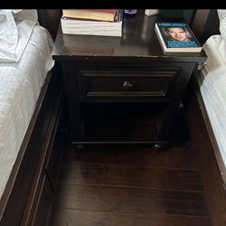 Two Twin Beds With A Night Table