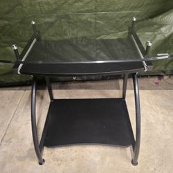Computer desk with tempered glass top.