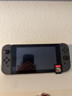 Nintendo Switch with Zelda and Controller