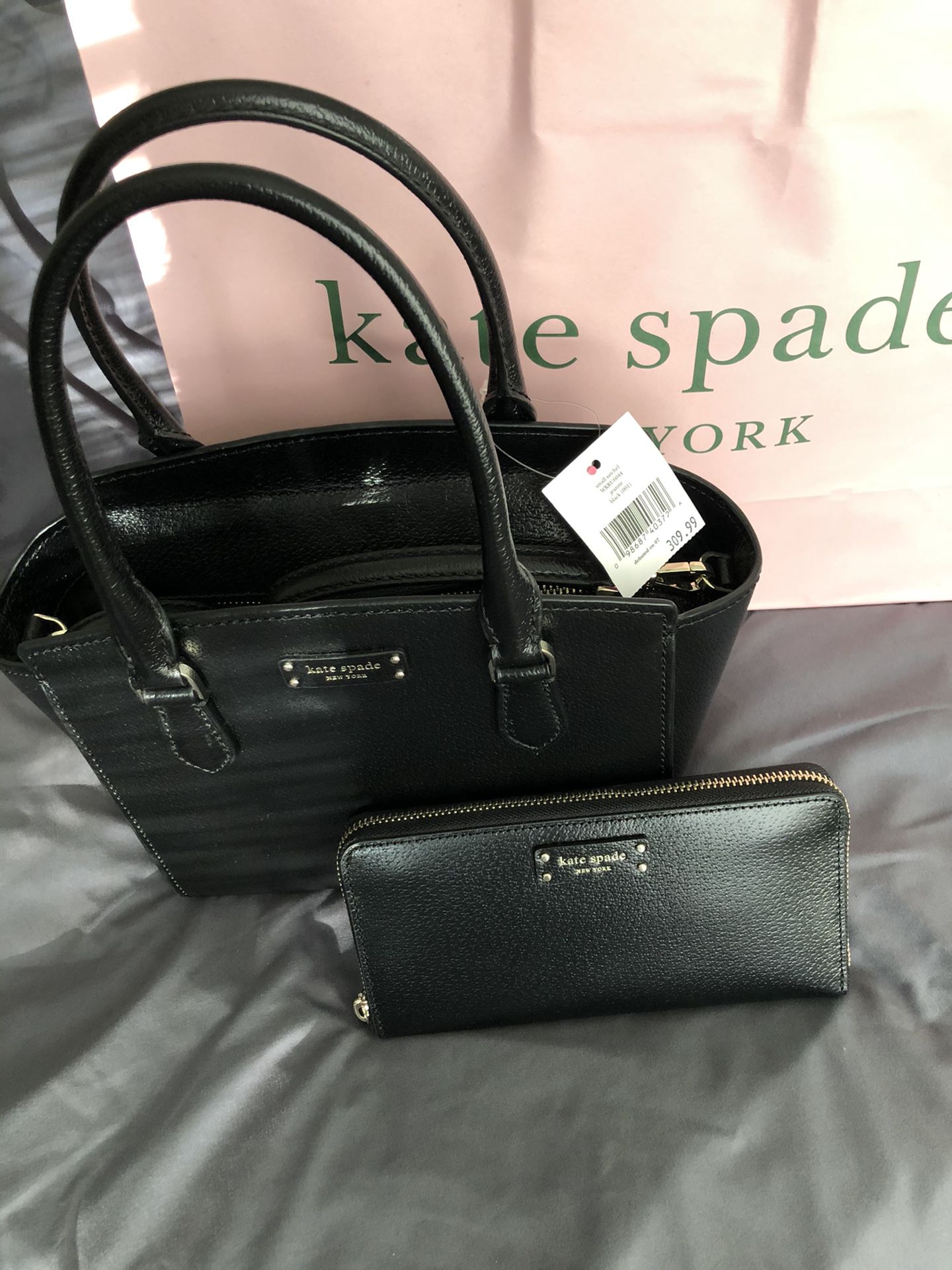 Kate Spade purse with matching wallet. Brand new never used. Still have tags and receipt. $479 value. Willing to trade for Apple products or ?