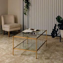 Glass and gold coffee table