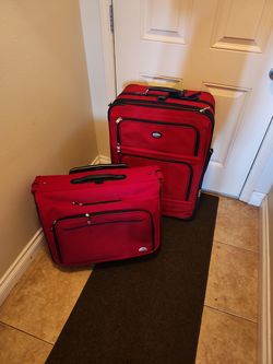 Pair of Pathfinder Roller Suitcases