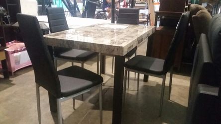 Brand new 5 piece table and chairs set