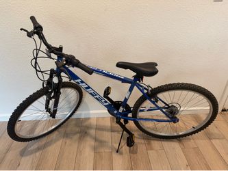 Blue Huffy mountain bike