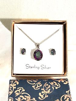 Brand new .925 silver pendant with Mystic topaz necklace with matching earrings. The necklace by itself retails for $125.