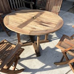 RockWood Brand Round Teak Table With 4 Matching Teak Folding Chairs  Located in concord Recently cleaned and oiled Teak wood is heavy and sturdy No da