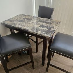 Table And Stools 