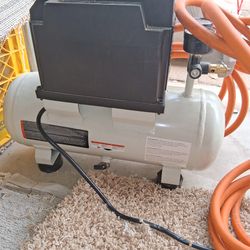 Two gallon air compressor and twenty five foot hose