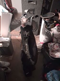 Golf clubs and bag golf balls tees golf shoes