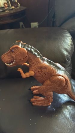 Dinosaur action figure toy, T-Rex lights up sound, and wall