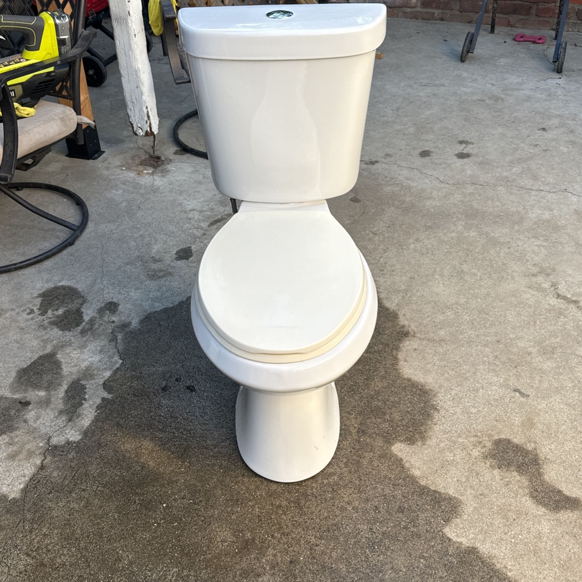 Glacier Bay Toilet Double Flush 17 1/2 Inches And 33 Inches Tall And 28 Inches In Depth