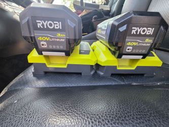Ryobi 40V lithium-ion power system, including multiple batteries and chargers.