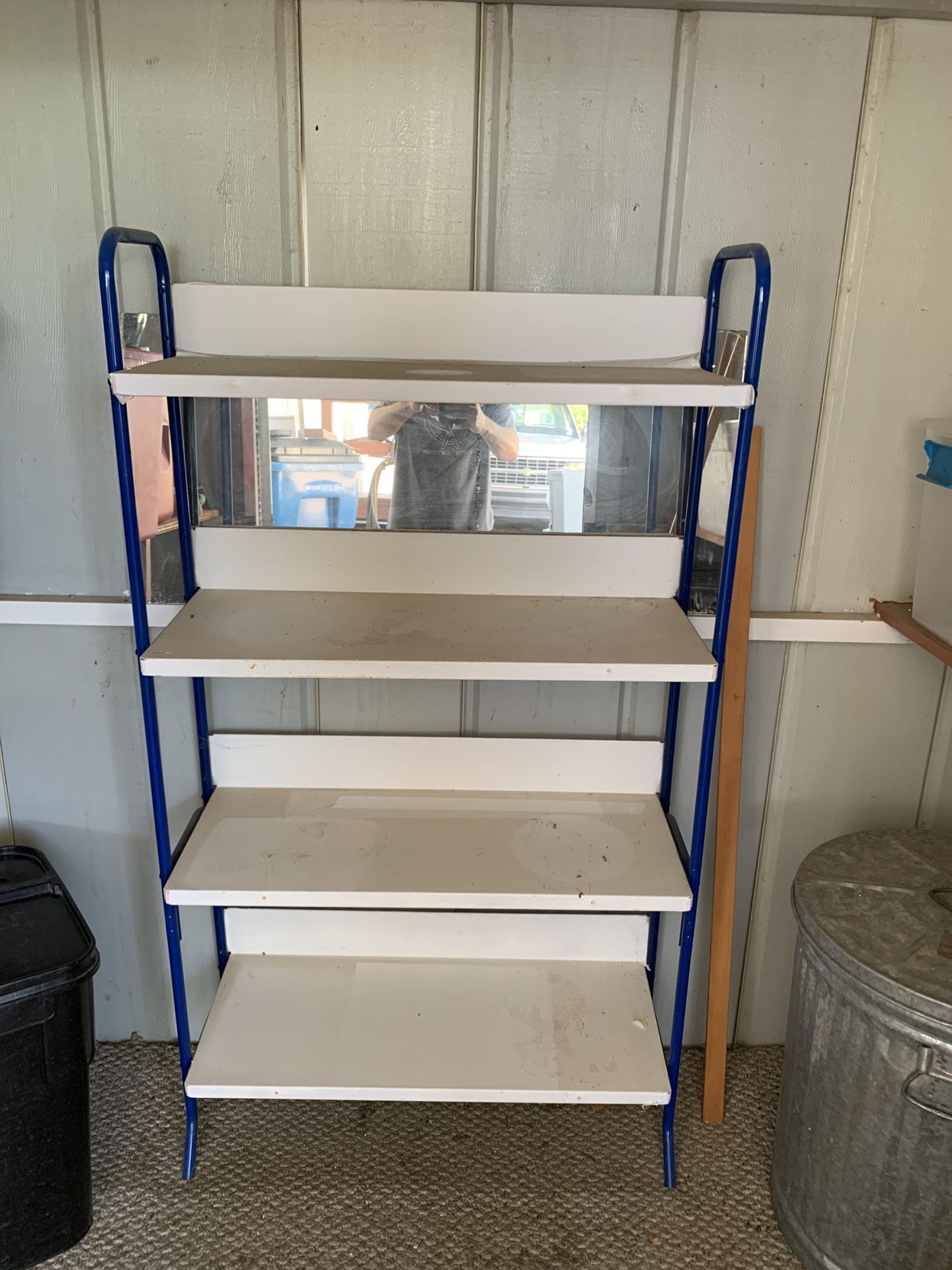 Metal storage rack in good condition. This is super solid. This measures 31 1/2 inches wide by 12 inches deep by 57 inches tall.