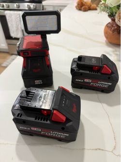 3 Milwaukee FORGE Batteries.. and floodlight and charger.. $500