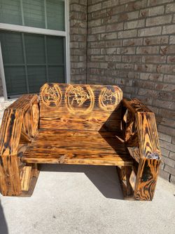 Wooden bench with carven designs