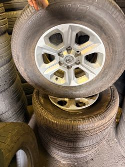 OEM Toyota Tundra wheels with tires for sale.