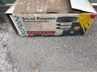 Solar powered garden lights. New.